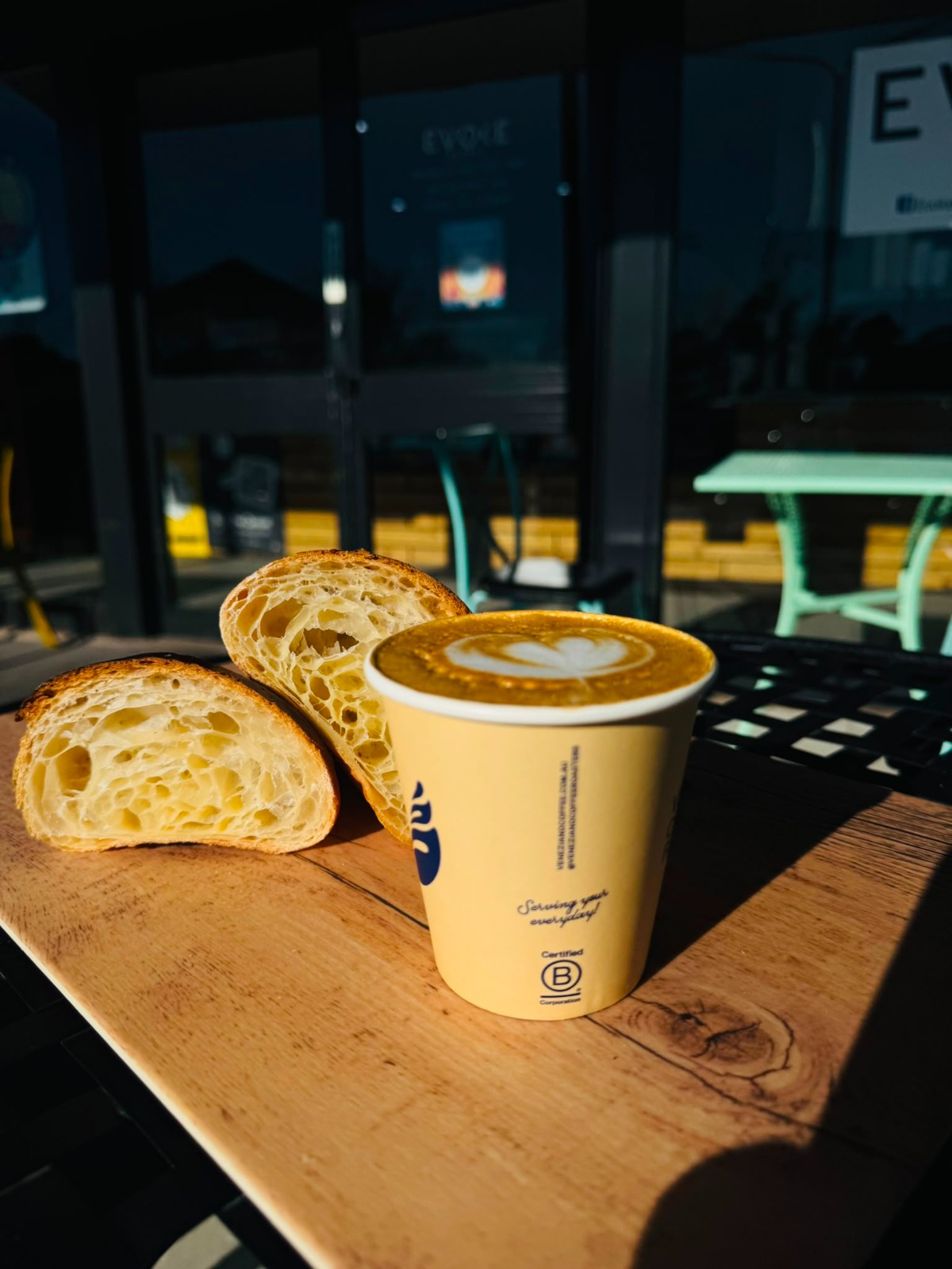Veneziano coffee with a freshly baked croissant at Evoke Bakery