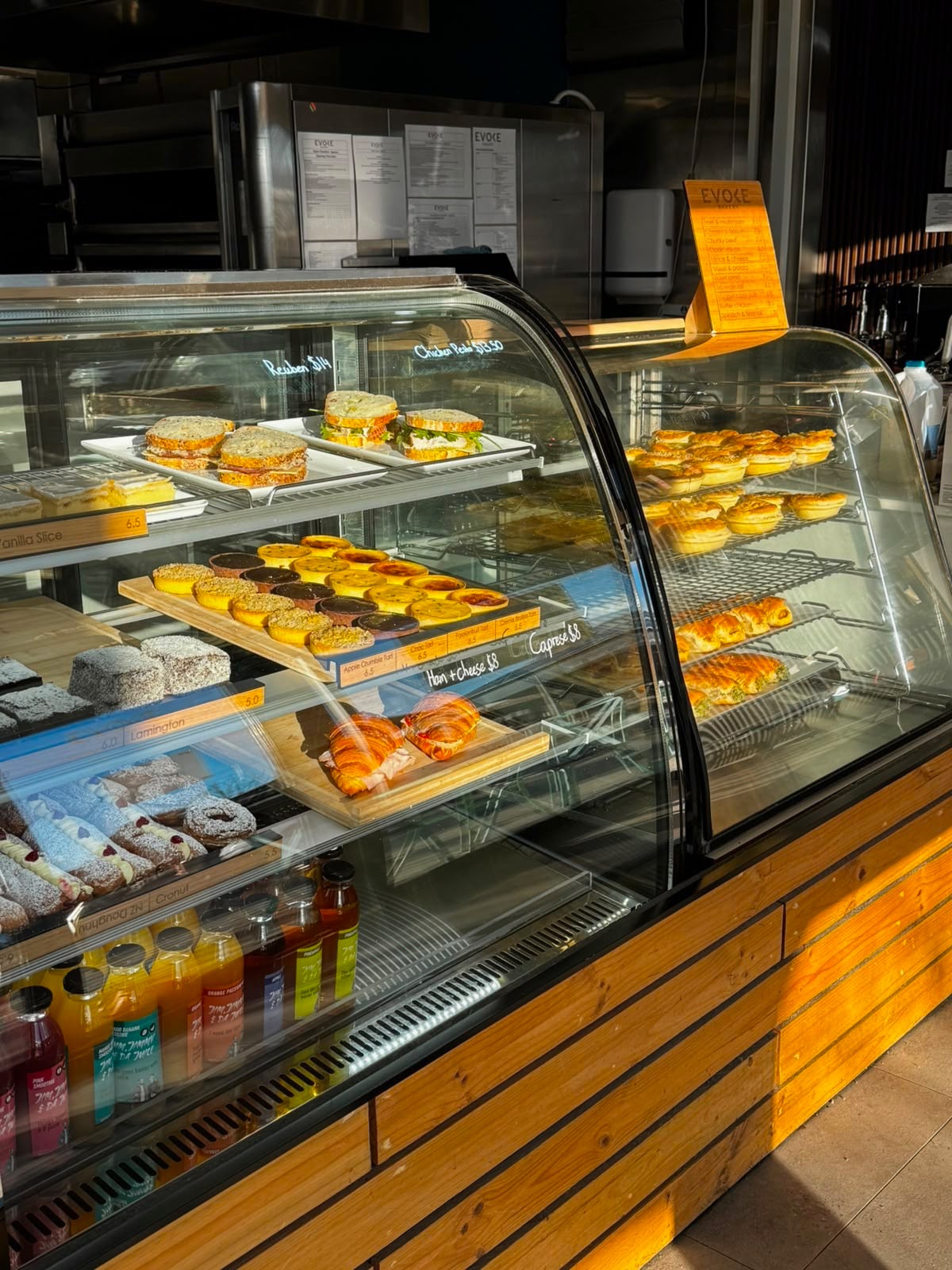 Evoke Bakery display counter filled with pastries, sandwiches and pies