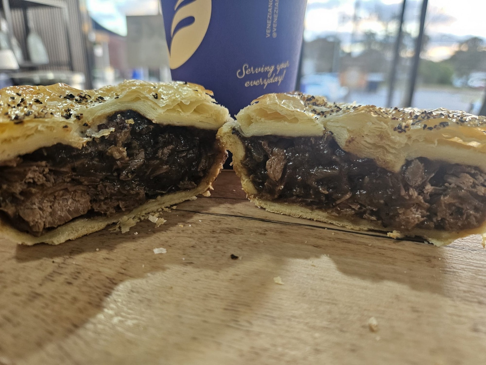 An Evoke roast meat pie cut open to show its generous filling